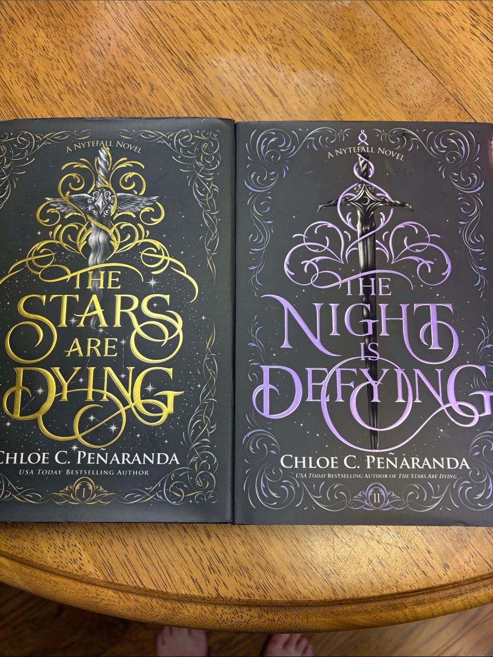 The Night Is Defying — Purple Hardcover Novel, and The stars are dying Novel